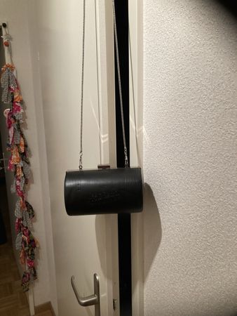 Pochette Jean Paul Gaultier noire cylindrique. Culte 1990’s.