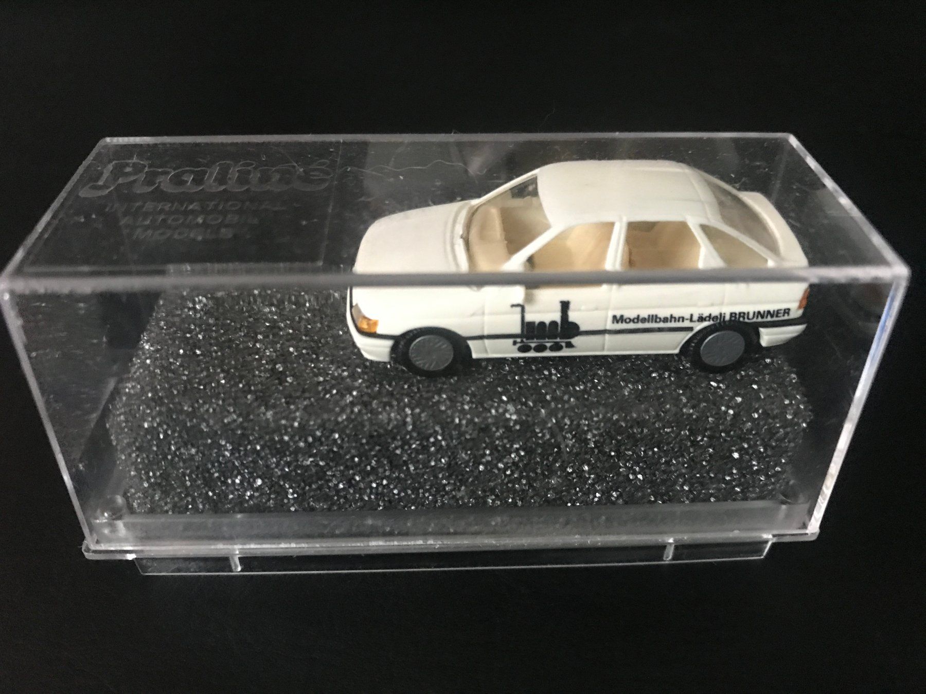 Praliné Modellini d'auto: Praline Ford Escort "Modellbahn-Lädeli Brunner" 1:87 selten – Usato da Herisau venduto da dak66 2