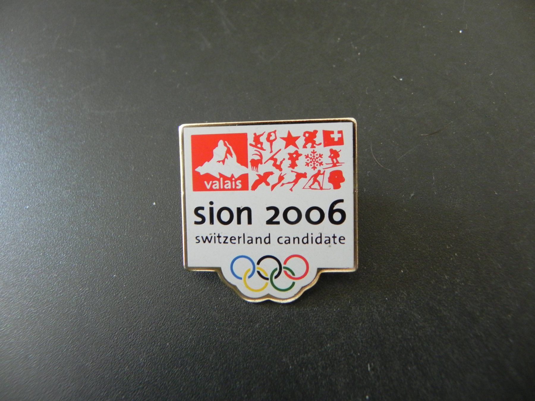 Spille & Fermagli: Pin Valais Olympia Sion 2006 – Usato da Biel/Bienne venduto da Gogolozi