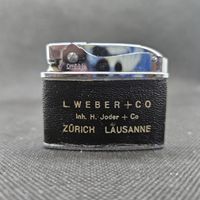 Omega Feuerzeug Vintage Leder Zürich Lausanne