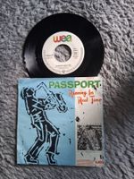 PASSPORT       RUNNING IN REAL TIME    7NER SINGLE