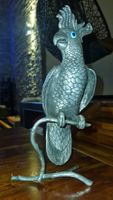 Kakadau Bronce versilbert