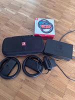 Nintendo Switch mit Lenkrad und Spielen