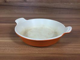 Gebrauchte kultige Oranger Auflaufform von Le Creuset