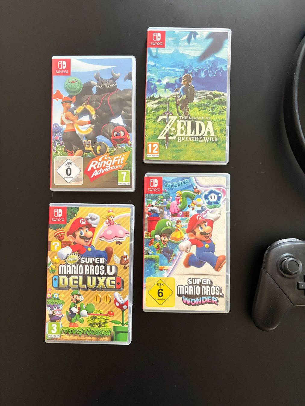 Nintendo Konsolen: Nintendo Switch Set + 4 Spiele + Pro Controller + Ring Fit – Gebraucht aus Steffisburg von Octabrain 1