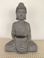 Buddha mit kerzenschale
