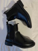 Bottines en cuir noir Zara