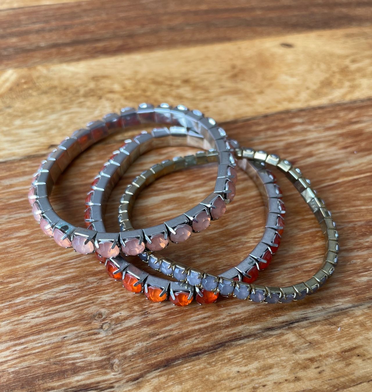 Bracciali & Braccialetti: 3 Stretcharmbänder – orange, lachs, olive – Usato da Grenchen venduto da M_ina 3