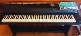 Yamaha Clavinova Piano mit Notenbücher und Anfängerleiste