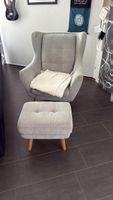 Gemütlicher Sessel mit Hocker