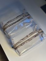 2x Transparente Kosmetiktasche mit Schlangenmuster