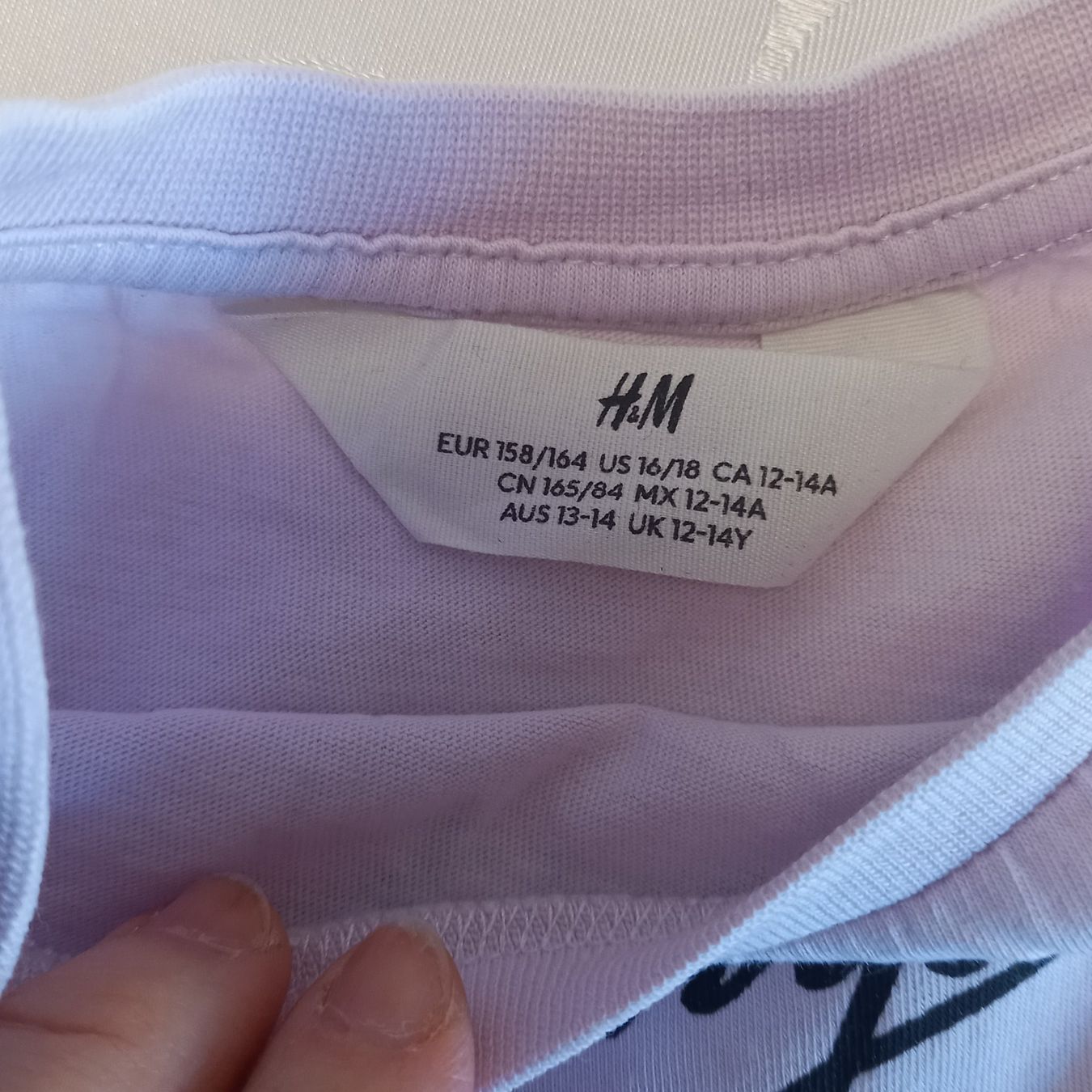 H&M Camicette, T-shirt & Top: H&M T-Shirt Upside Down Gr.158/164 – Usato da Brüttisellen venduto da kikaninchen79 1