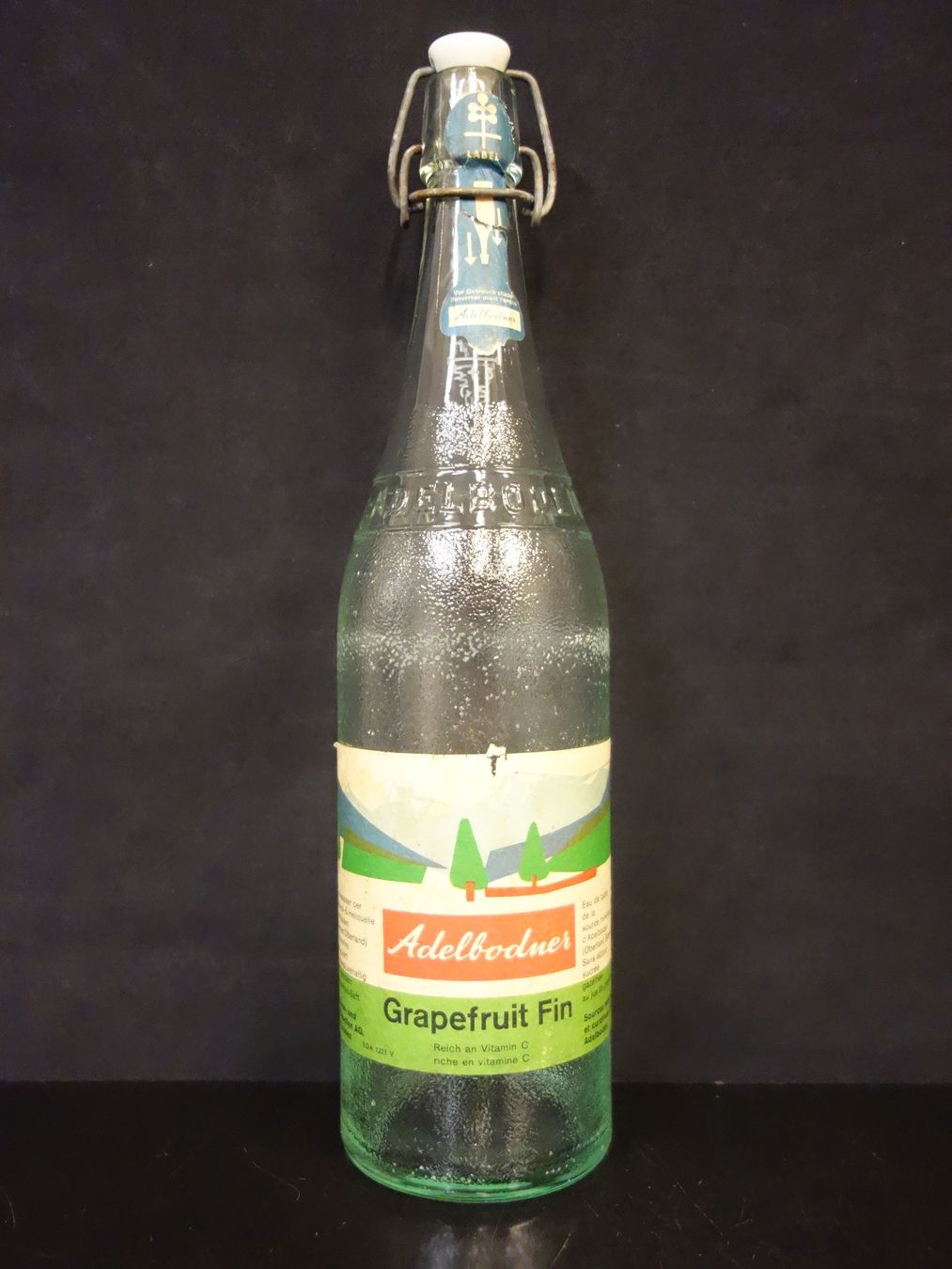 Bicchieri, Caraffe & Bottiglie: alte Flasche ADELBODNER GRAPEFRUIT FIN 1965 – Usato da Kerzers venduto da Flaschenposten
