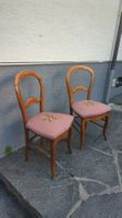 Antique wooden chair with floral fabric upholstery