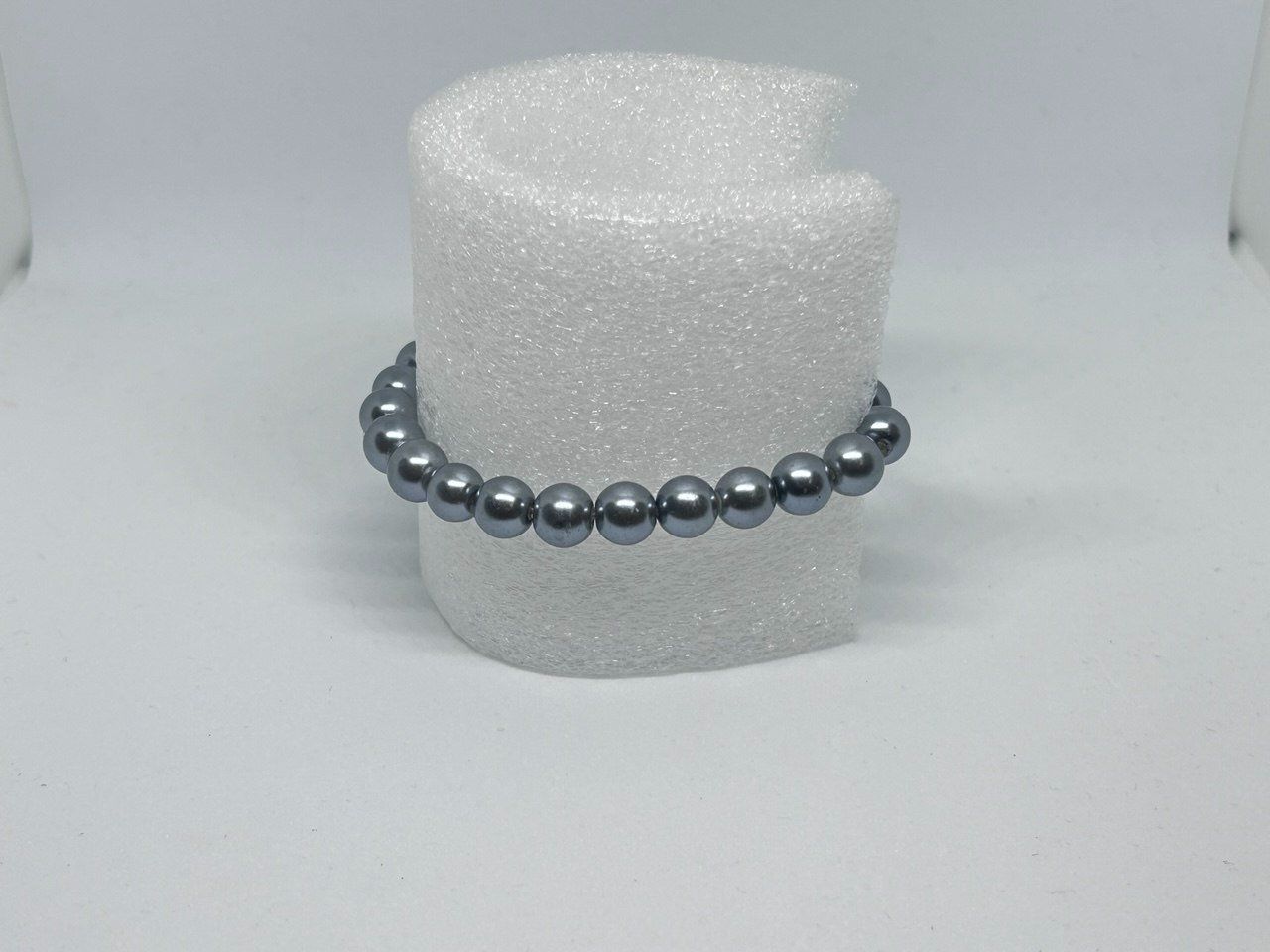 Bracciali & Braccialetti: Bracciale elastico con perle sintetiche grigio antracite – Usato da Giubiasco venduto da LorisVale