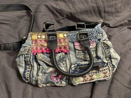 Denim handbag embellished with ethnic patterns and sequins