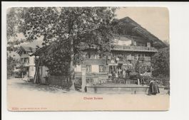 AK ca.1900 Chalet Suisse mit Frau am Brunnen