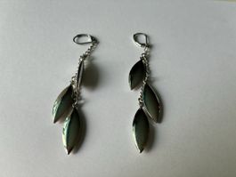 Silver tone dangle earrings leaf design