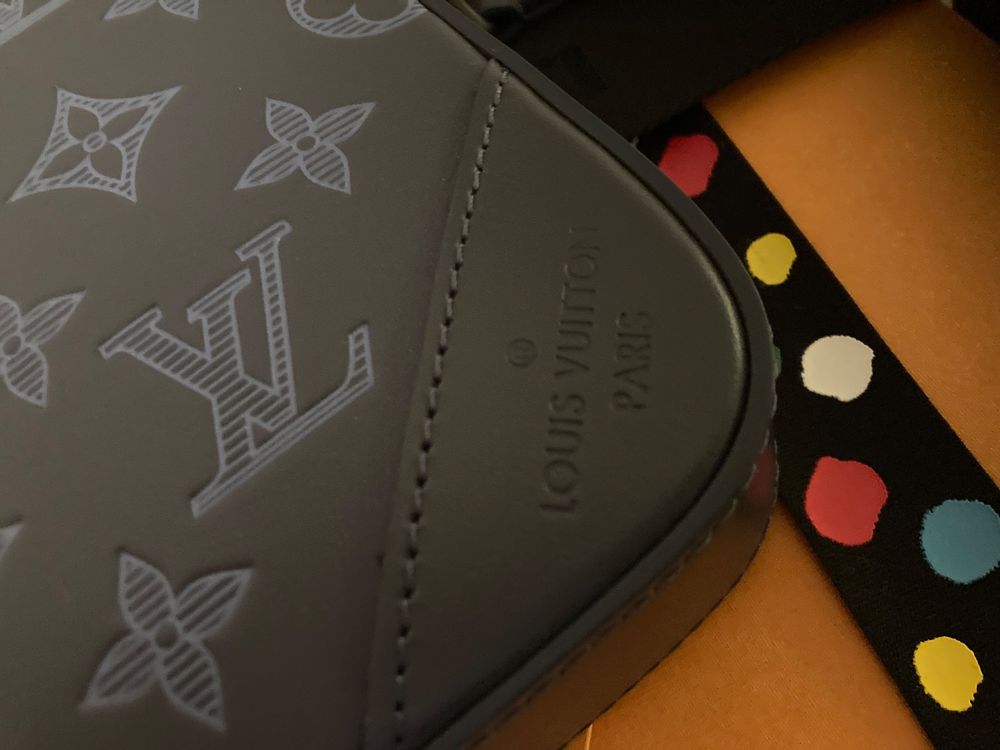 Louis Vuitton Messenger Duo en cuir avec facture