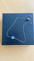 Bracelet fin argenté avec pendentif oeil bleu protecteur