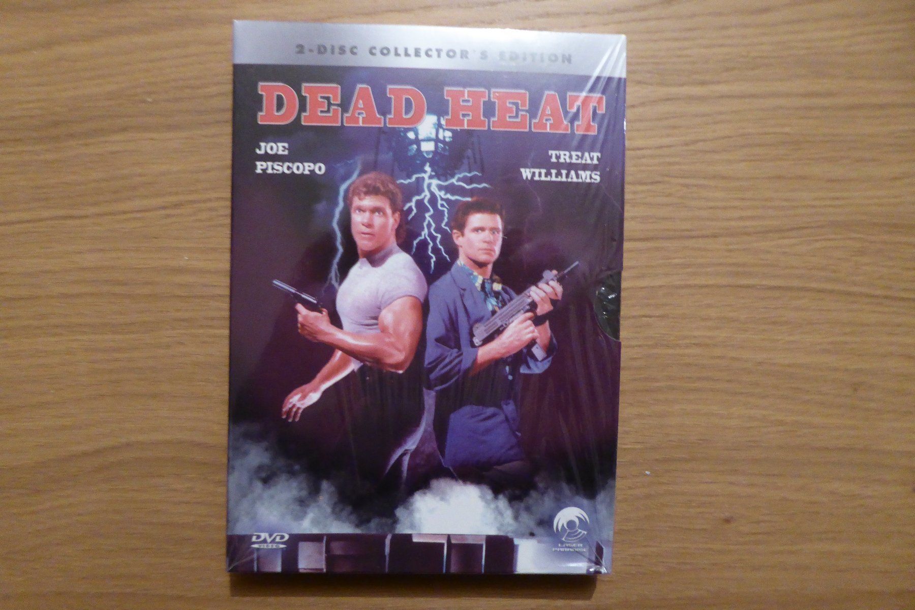 Alle DVDs: DVD OVP Dead Heat Folienriss – Neu und originalverpackt aus Allschwil von Summelsarium
