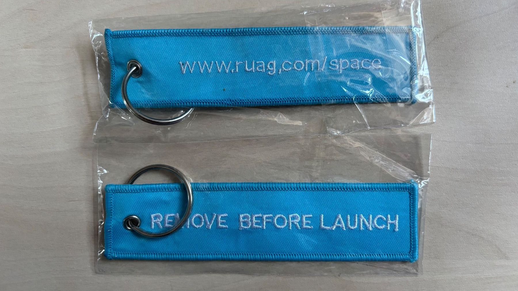 Porte-clés: 1 Schlüsselanhänger Ruag Space "Remove before launch" – Neuf avec emballage d'origine à Hochfelden par aviatikboerse_top