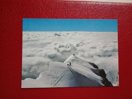 Bergsteiger auf dem Piz Palu GR Nebelmeer