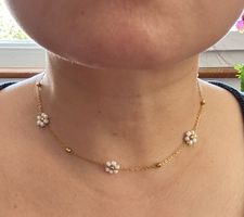 New necklace with white beaded flowers and gold chain