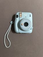 türkise instax Polaroidkamera 
