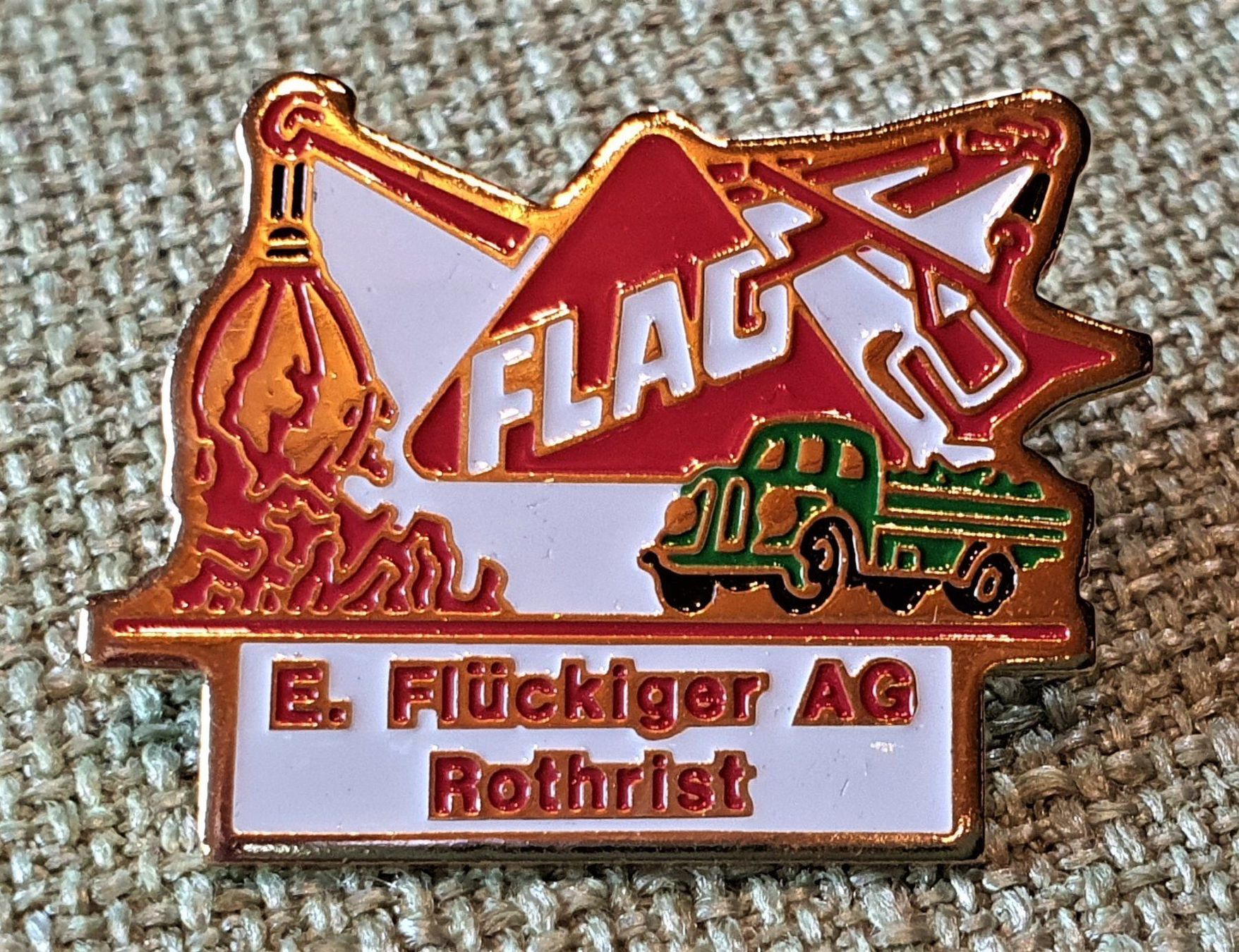 Placchette & Badge: B542 - Pin FLAG E. Flückiger AG Rothrist – Usato da Reinach BL venduto da Boston-Verkauf