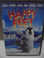 " Happy feet " en français, english, flamish, excellent état