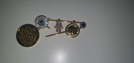 Elegant gold-toned pin with charms - perfect gift!