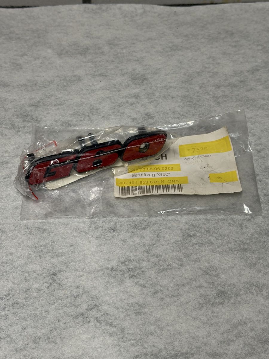 Volkswagen Tutti pezzi di ricambio auto: Corrado Frontgrill Emblem original / G60  – Nuovo e nell'imballaggio originale da Oberkirch LU venduto da Feuerpferd 1