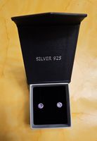 Elegante Silber 925 Ohrstecker mit lila Zirkonia Steinen