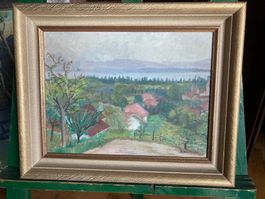 Tableau signé M.Wüthrich, un village au bord d'un lac.