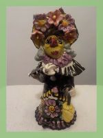 Waggis Figur alte Dante mit Blumenhut und Regenschirm