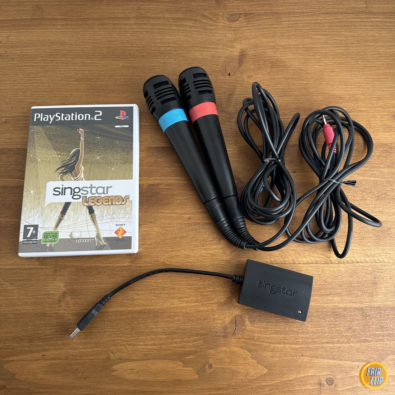 Spiele: PS2 SingStar Legends mit 2 Mikrofonen + USB Adapter – Gebraucht aus Luzern von fairflip
