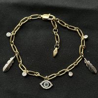 18KGP Fossil Nazar Auge und Federn Charms Armkette