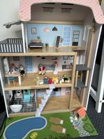 Dollhouse with furniture and figures, good condition
