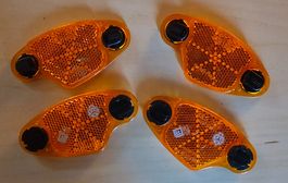 Set de 4 réflecteurs oranges pour vélo. Neuf.