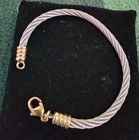 Bracelet mixte  bicolore et pl.or. Jonc  souple. Ferme  bien