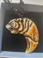 collier corne tigre asia