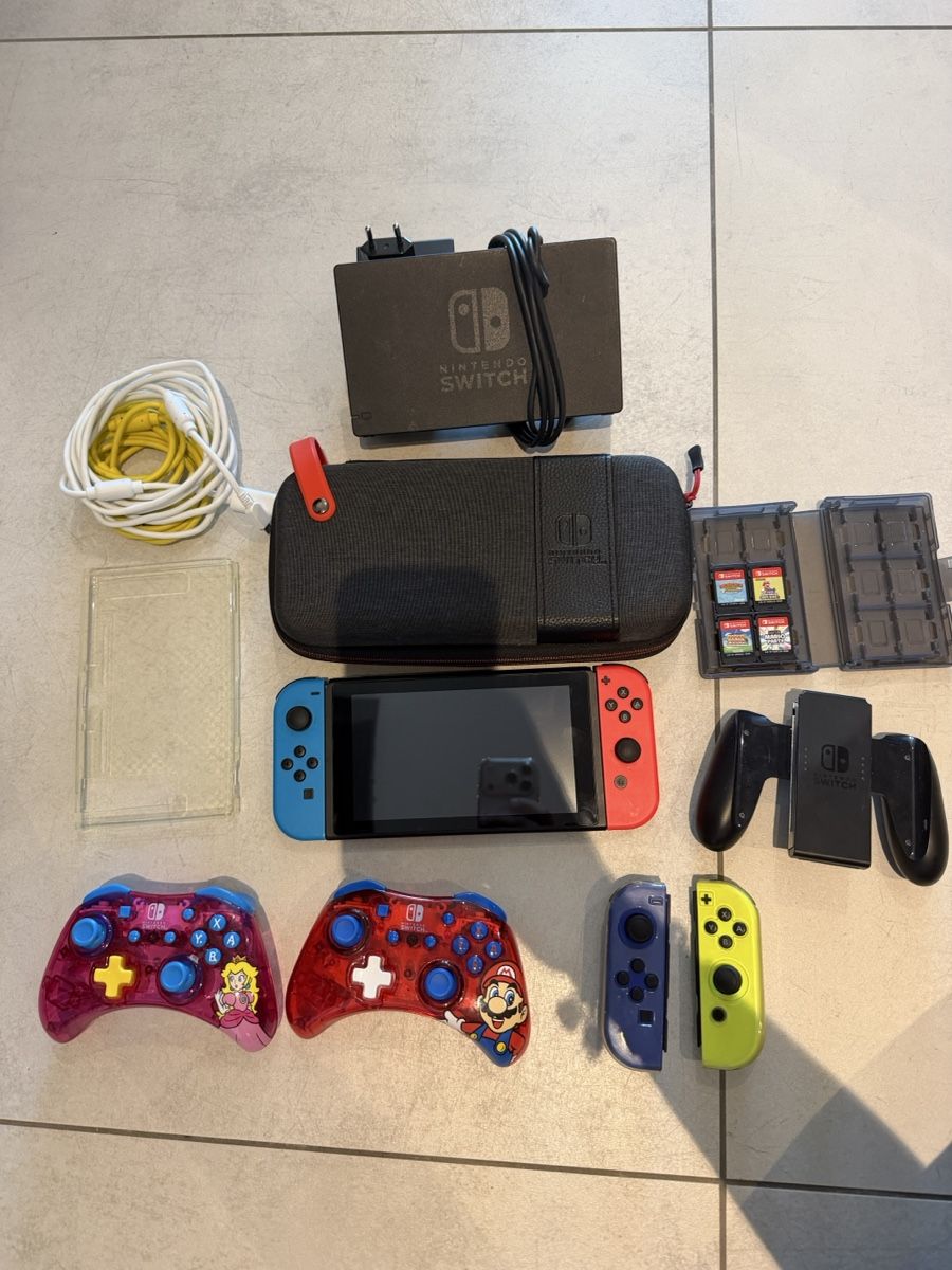 Nintendo Consoles: Nintendo Switch avec accessoires et jeux - – D'occasion à La Chaux-de-Fonds par sou_2rjx