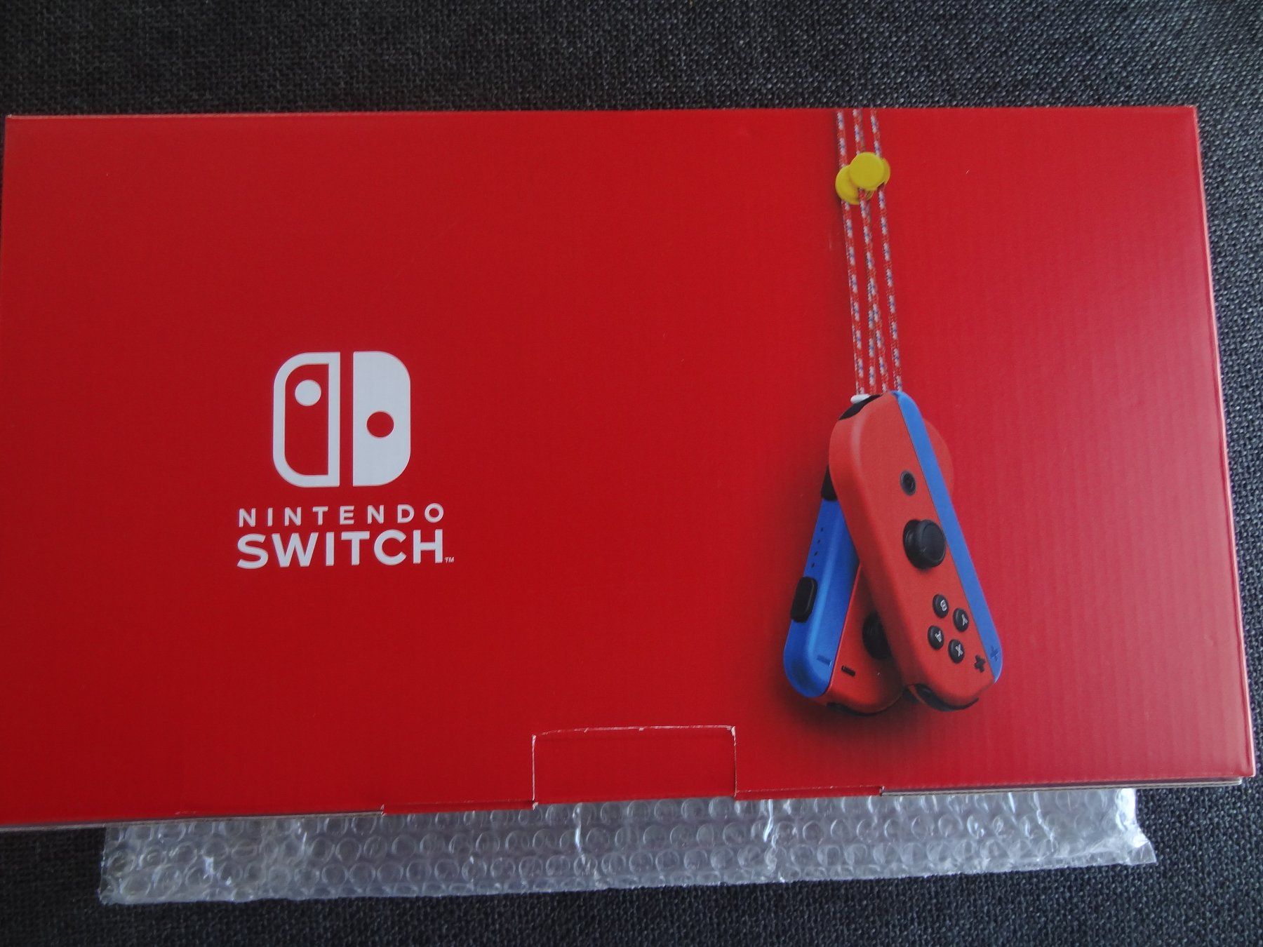 Nintendo Konsolen: Nintendo Switch V2 Mario Edition NEU – Neu und originalverpackt aus Lyss von Famicom 1