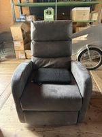 Bequemer grauer Sessel