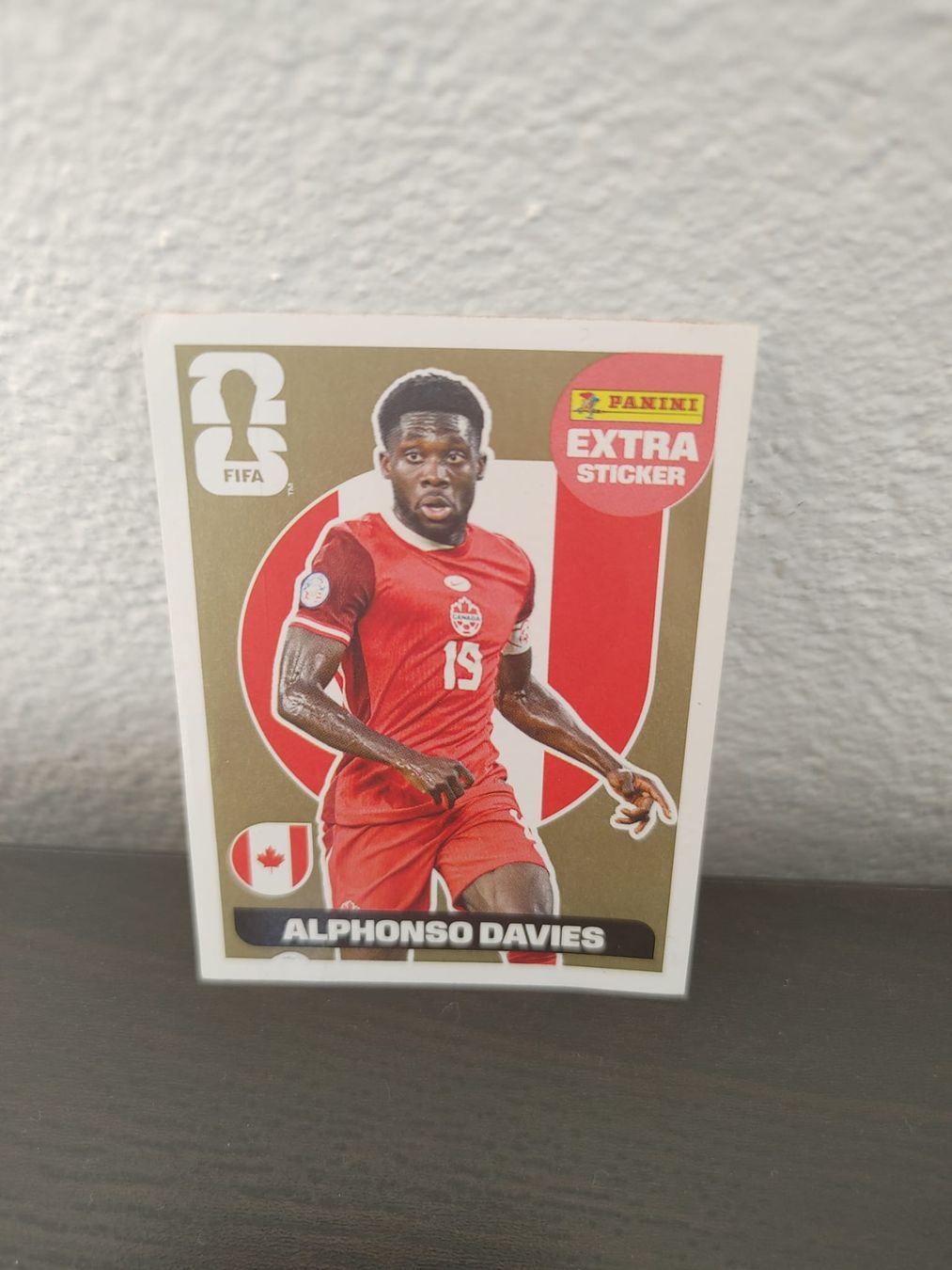 Panini Carte collezionabili: Panini WM 2026 Extra Sticker Gold -  Alphonso Davies – Nuovo (secondo la descrizione) da Niederweningen venduto da Davebond888