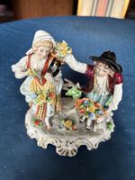 Antike Figurengruppe “Blumenverkäufer”