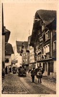 Strasse in Andermatt. Gasthaus Ochsen, Kutschen