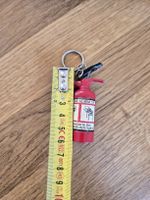 Briquet porte-clés extincteur rouge, état usagé