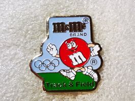 Ansteckpin 95: m&m's x Olympia